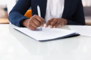 Businesswoman signing a contract